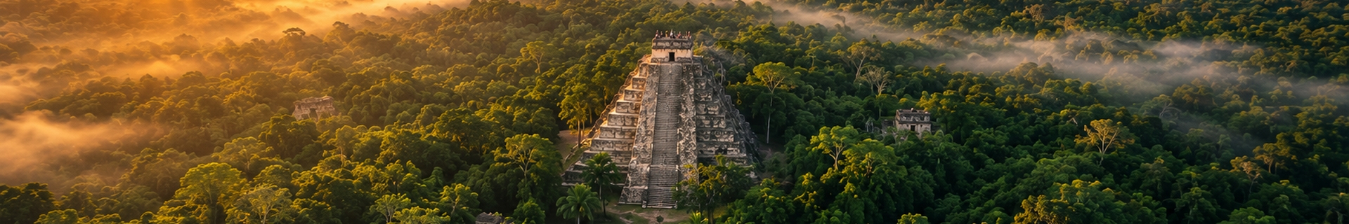 Nohoch Mul pyramid rising above dense jungle canopy at the Cob&aacute; ruins