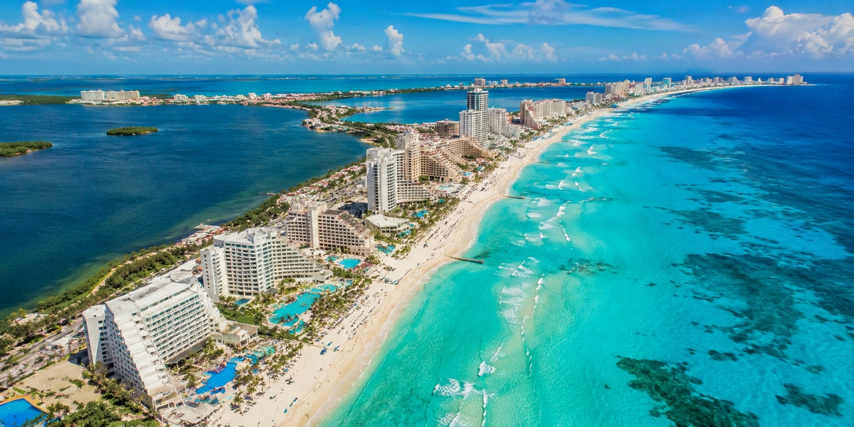 Cancun Hotel Zone beachfront and resorts from above, showing where a group can base